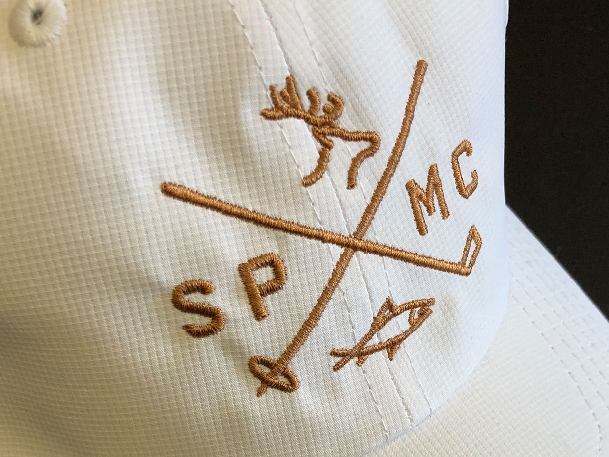 Spanish Peaks Mountain Club golf hat brand design embroidery detail